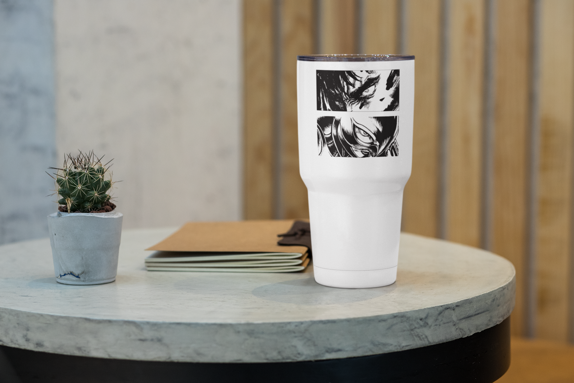 a white cup sitting on top of a table next to a plant