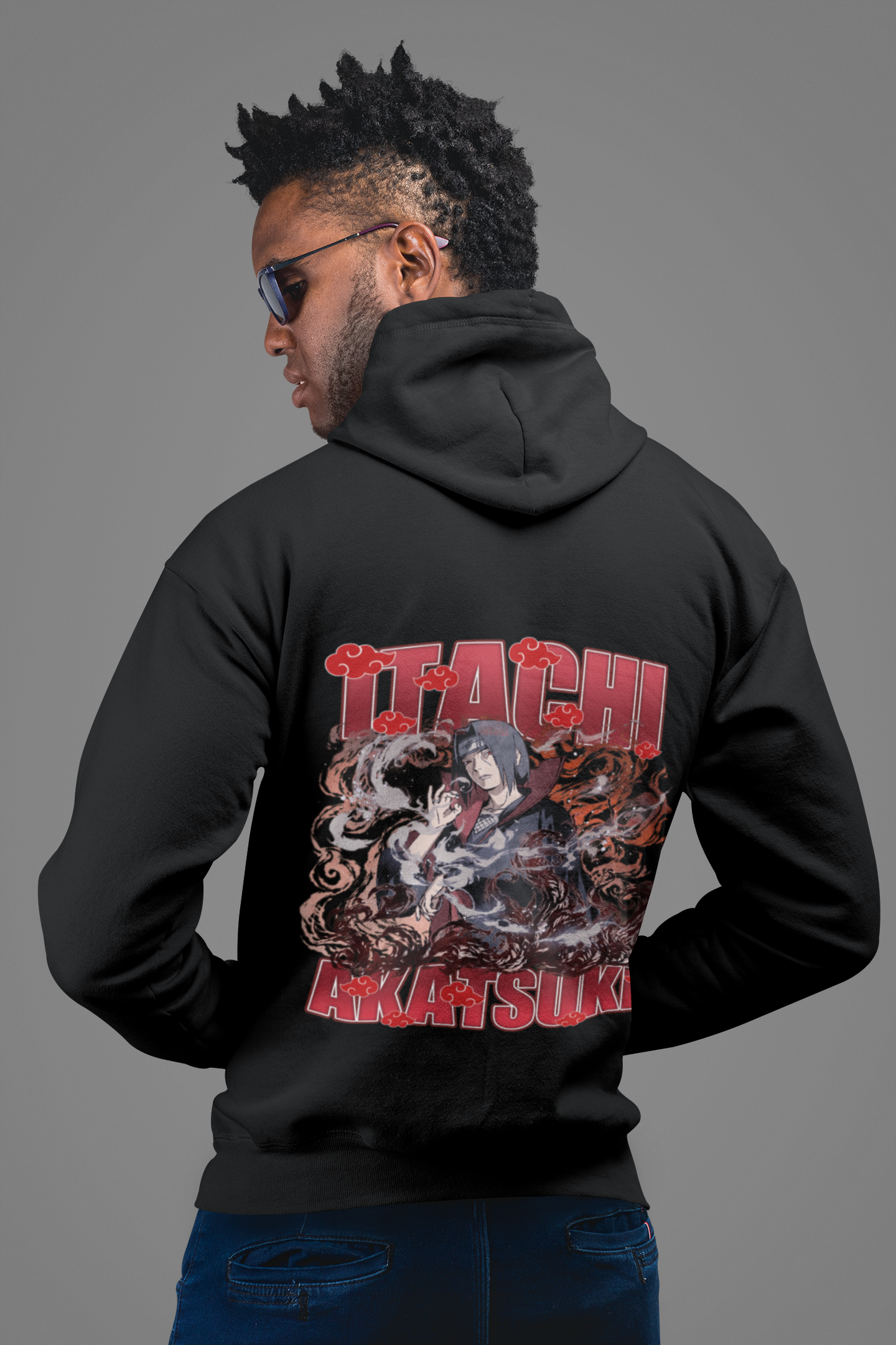 a man with dreadlocks wearing a black hoodie