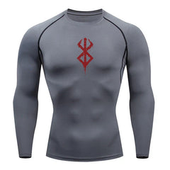 a grey shirt with a red design on the chest