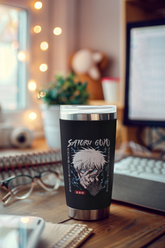 a coffee cup sitting on top of a wooden desk