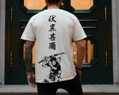 a man wearing a t - shirt with a picture of a man holding a sword