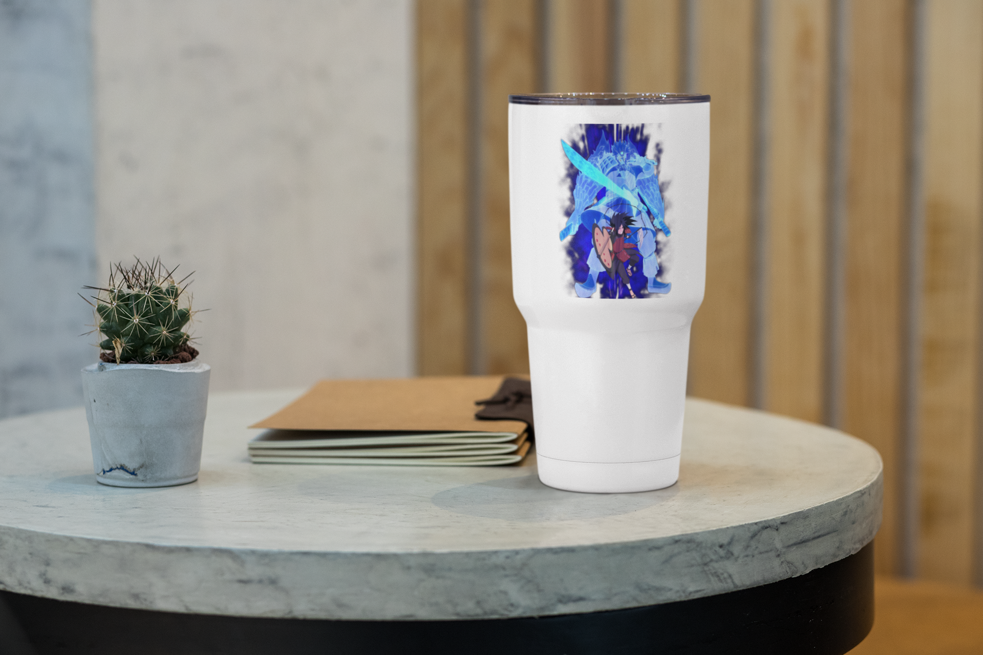 a white cup sitting on top of a table next to a plant