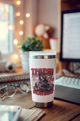 a coffee cup sitting on top of a wooden desk