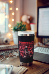 a coffee cup sitting on top of a wooden desk