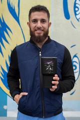 a man with a beard holding a book