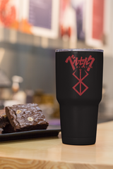 a cup of coffee and some brownies on a table