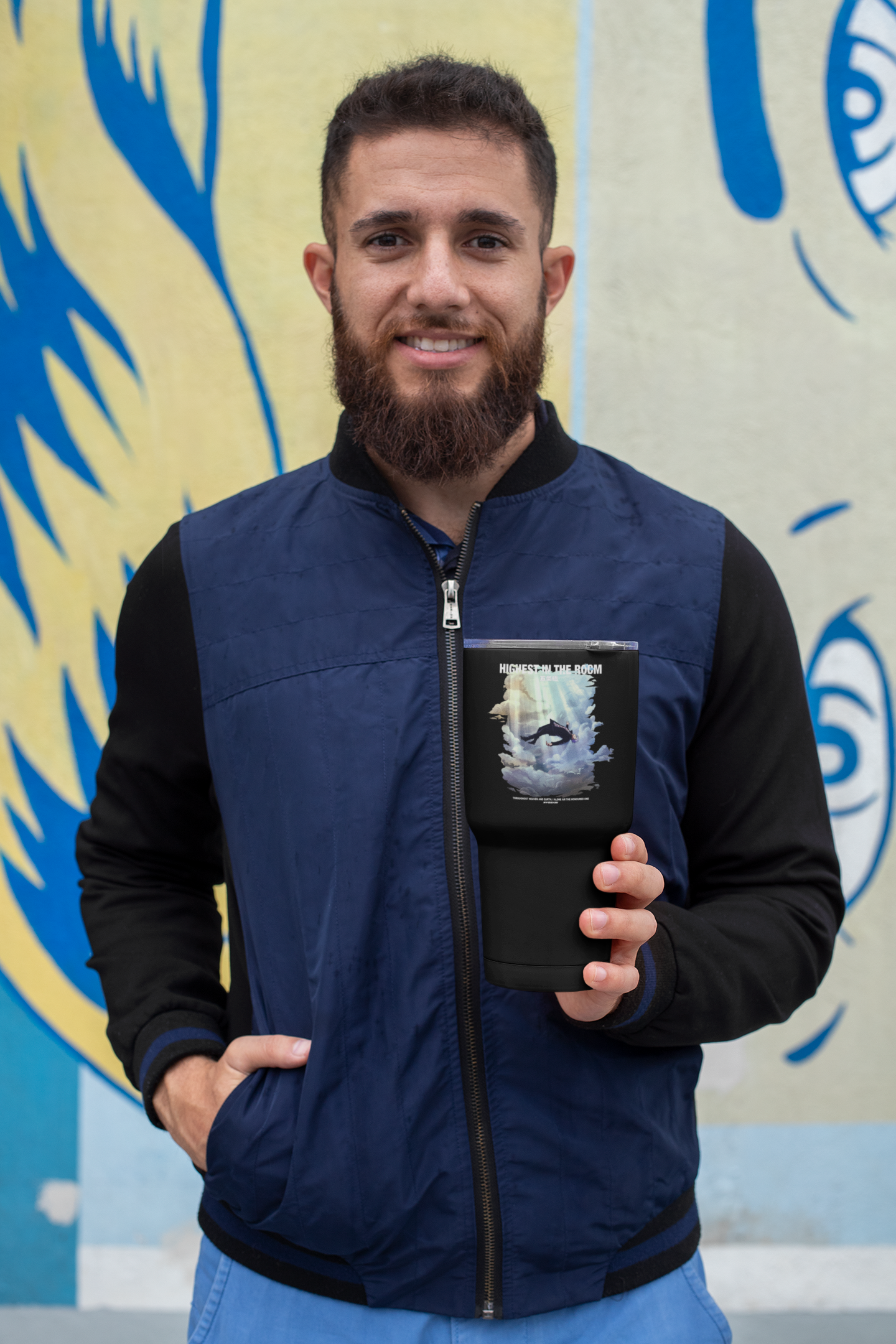 a man with a beard holding a book