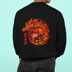 a man wearing a black sweatshirt with a picture of a dragon on it