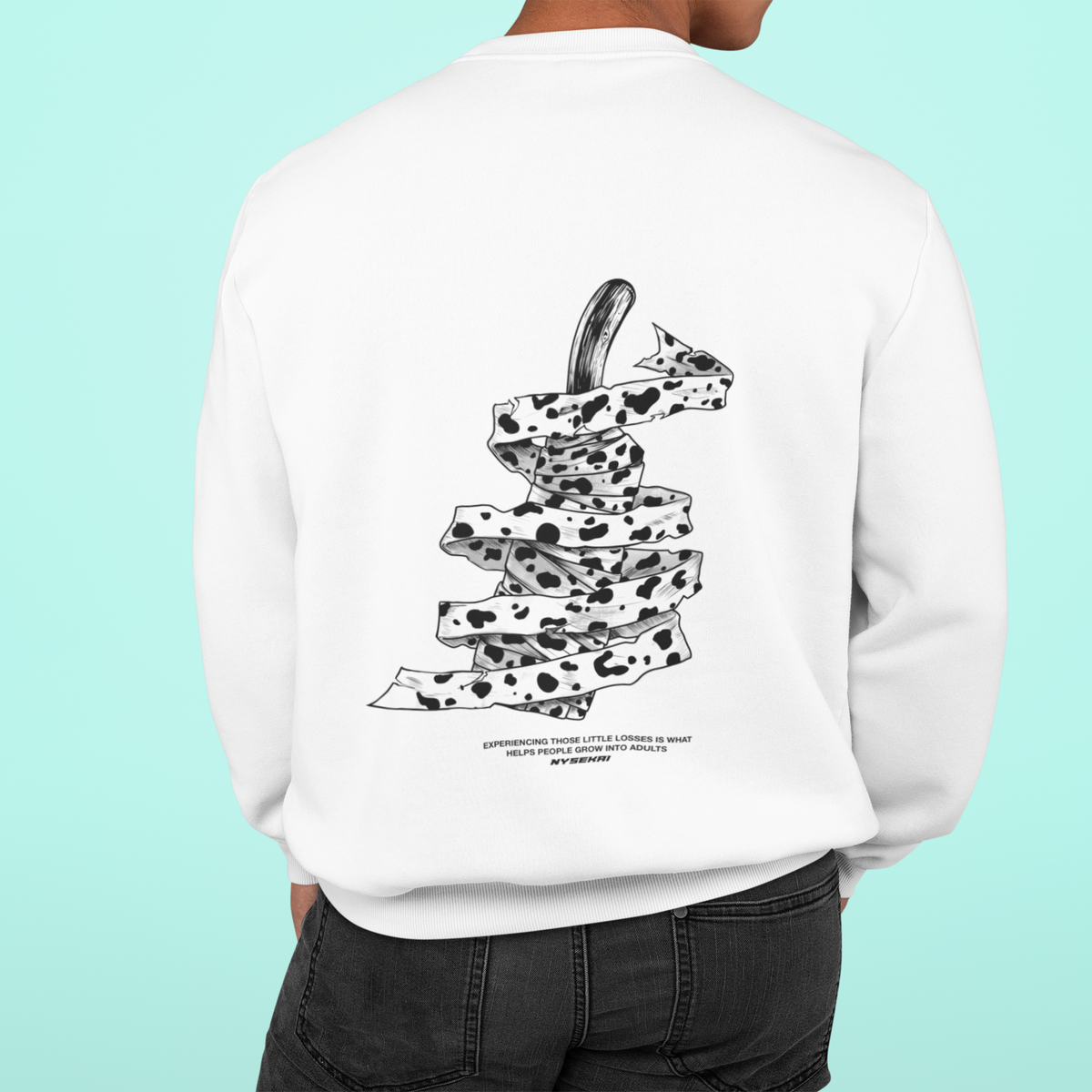 a man wearing a white sweatshirt with a dalmatian print on it