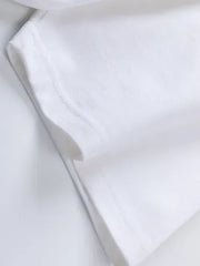 a close up of a white shirt on a white surface