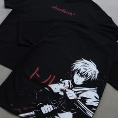 a black shirt with a picture of a person holding a gun