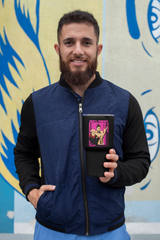 a man with a beard holding a tablet