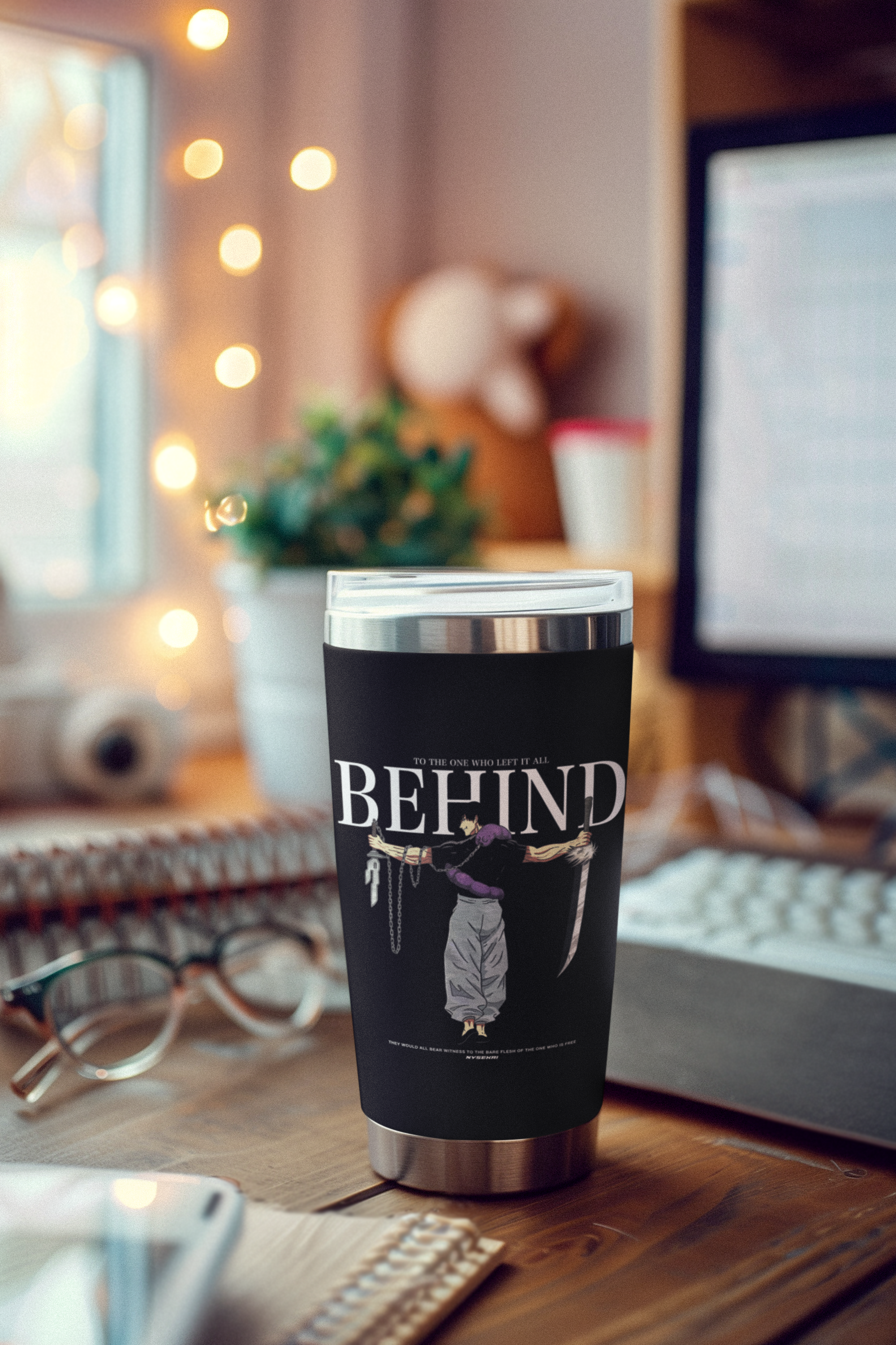 a coffee cup sitting on top of a wooden desk