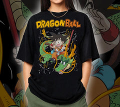 a woman standing in front of a dragon ball t - shirt