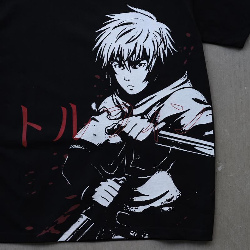 a black t - shirt with a picture of a guy holding a gun