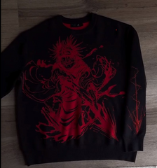 a black sweater with a red design on it