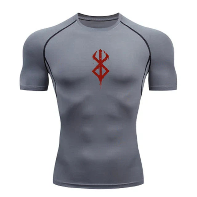 a grey shirt with a red design on the chest