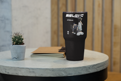 a black tumbler cup sitting on top of a table