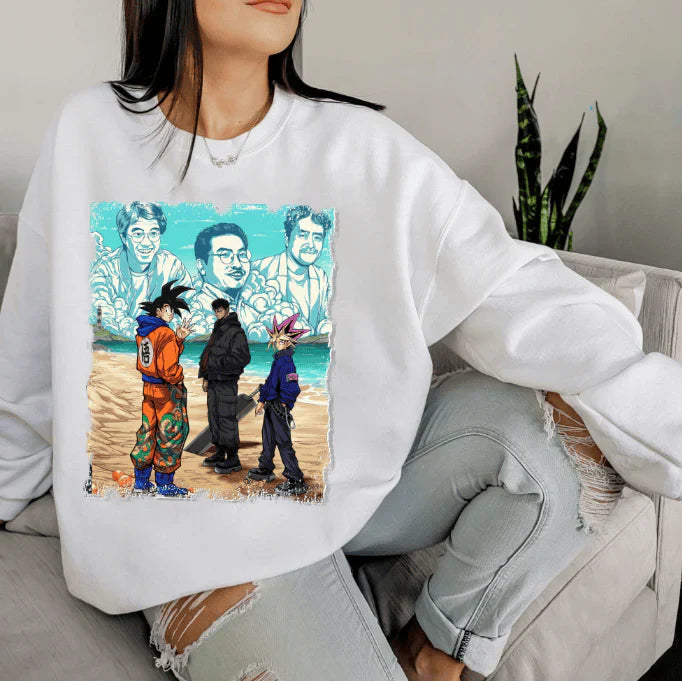 a woman sitting on a couch wearing a white sweatshirt with a picture of two men