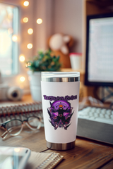 a coffee cup sitting on top of a wooden desk