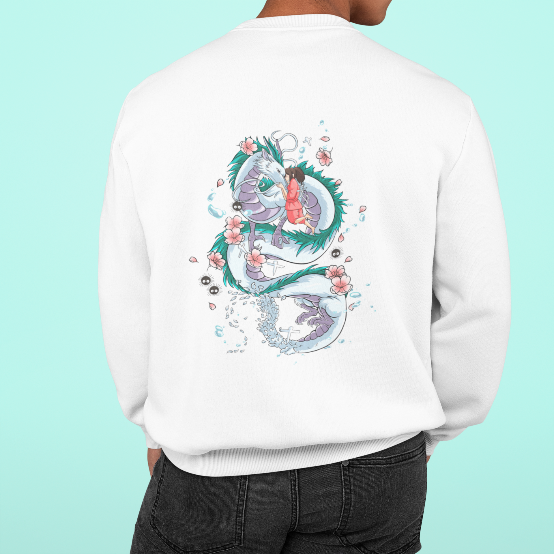 a man wearing a white sweatshirt with a dragon on it