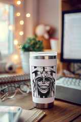 a coffee cup sitting on top of a wooden desk